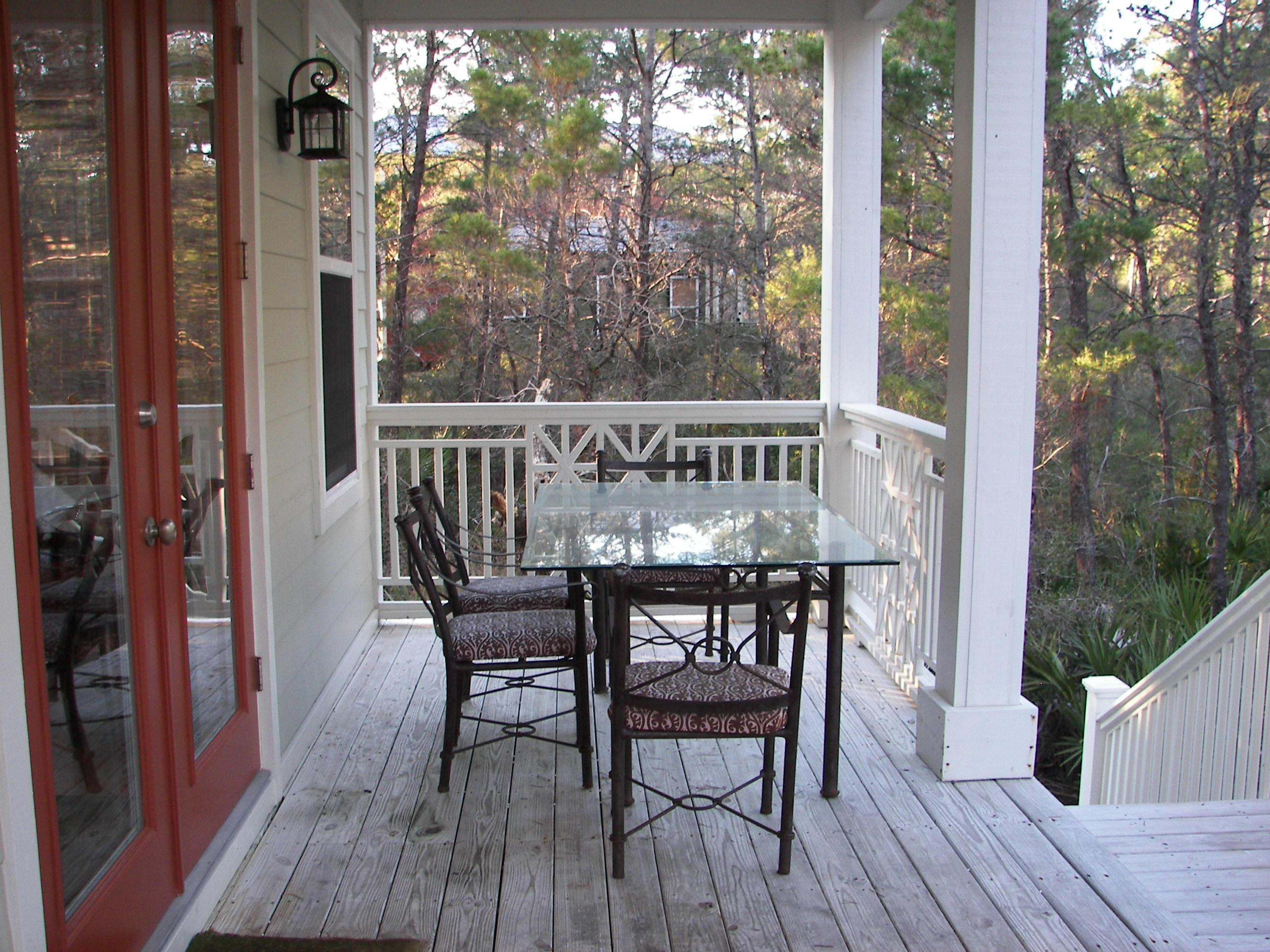 69 Lifeguard Loop West Inlet Beach, FL 32461 - Photo 17 of 34 a view of balcony with furniture and wooden floor