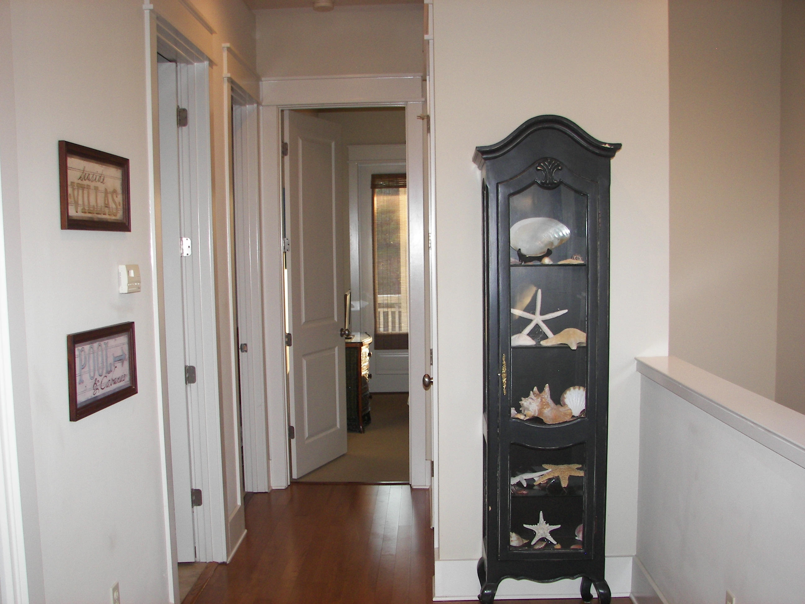 69 Lifeguard Loop West Inlet Beach, FL 32461 - Photo 20 of 34 a view of a hallway with wooden floor and front door