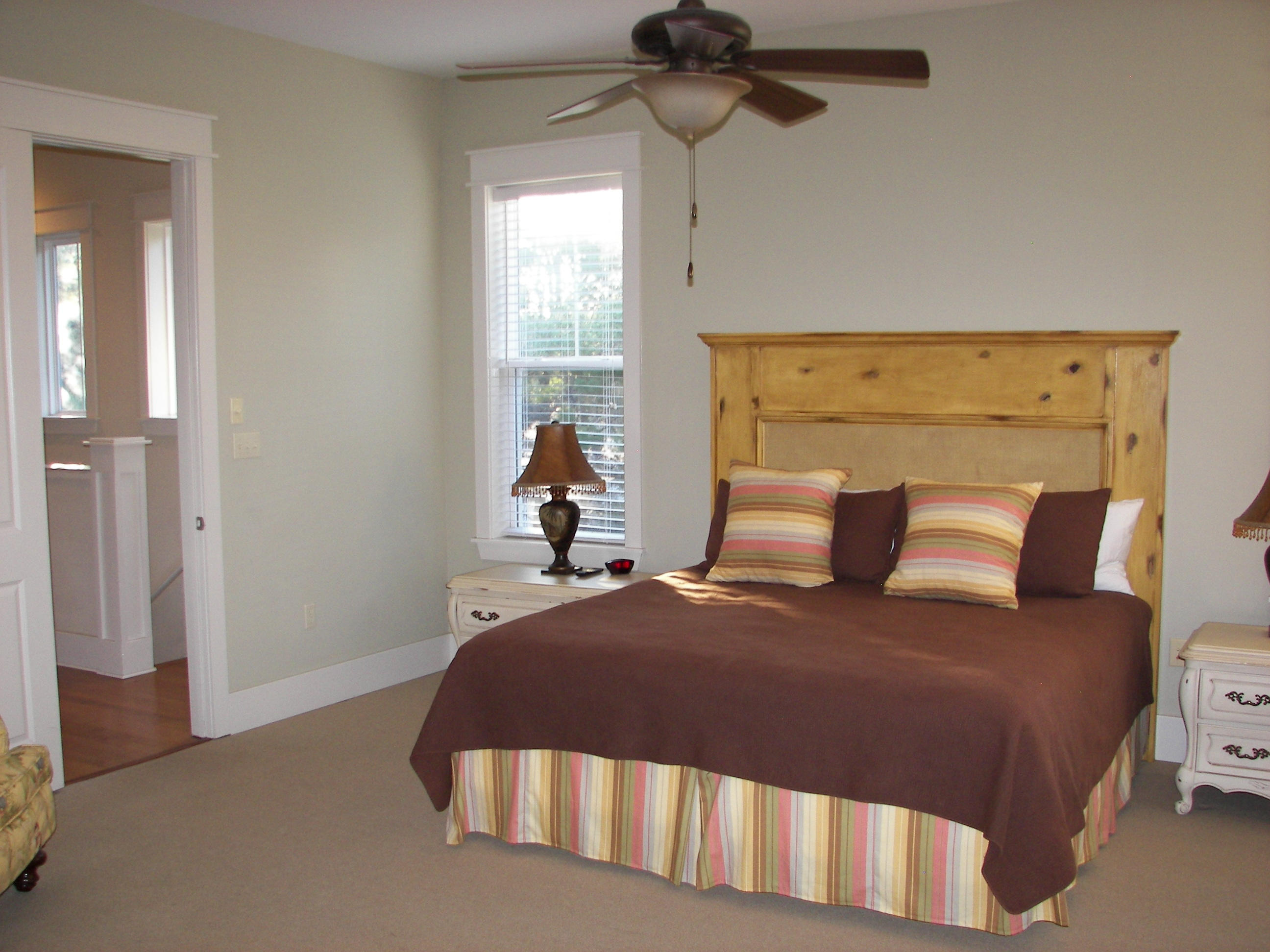 69 Lifeguard Loop West Inlet Beach, FL 32461 - Photo 21 of 34 a bedroom with a bed and window