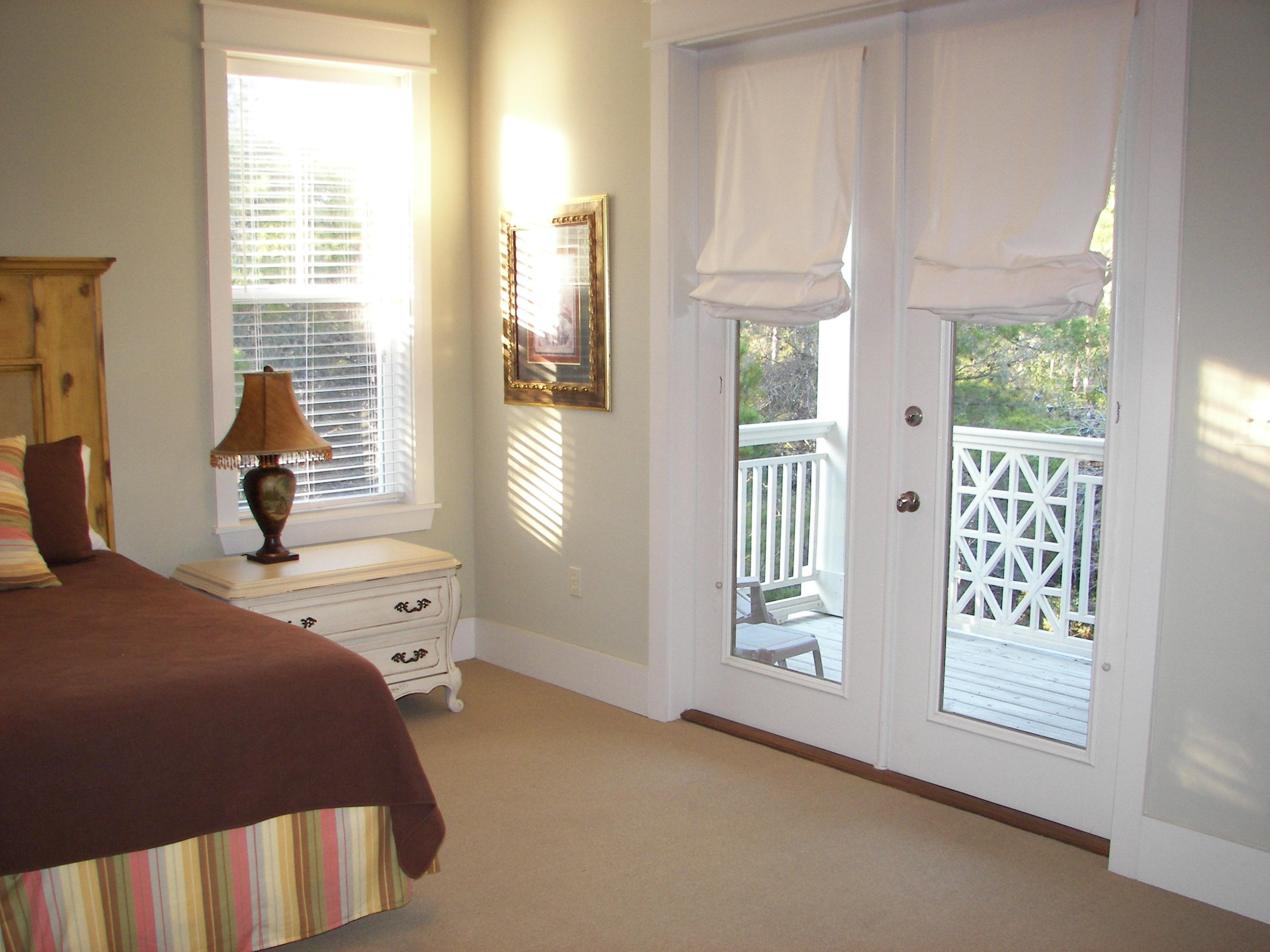 69 Lifeguard Loop West Inlet Beach, FL 32461 - Photo 23 of 34 a bedroom with a bed and a window
