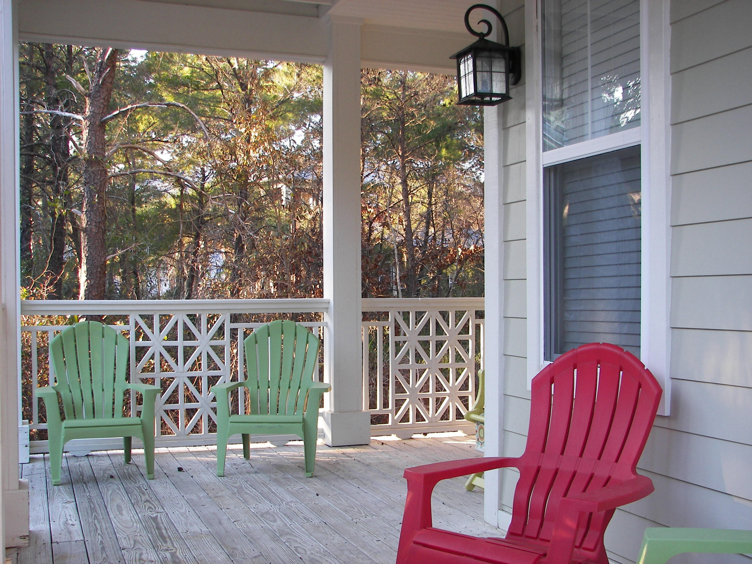 69 Lifeguard Loop West Inlet Beach, FL 32461 - Photo 4 of 34 a view of porch with two chairs and a potted plant