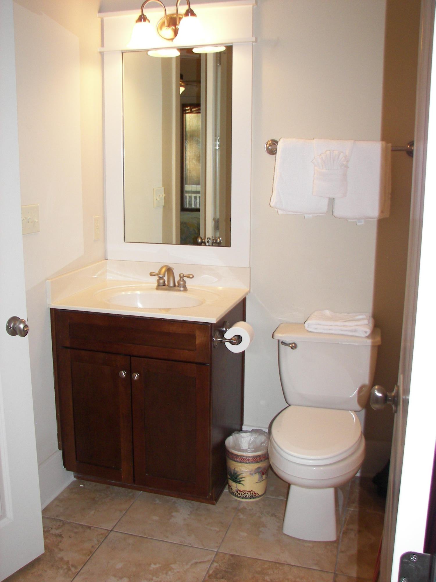 69 Lifeguard Loop West Inlet Beach, FL 32461 - Photo 31 of 34 a bathroom with a toilet sink vanity and mirror