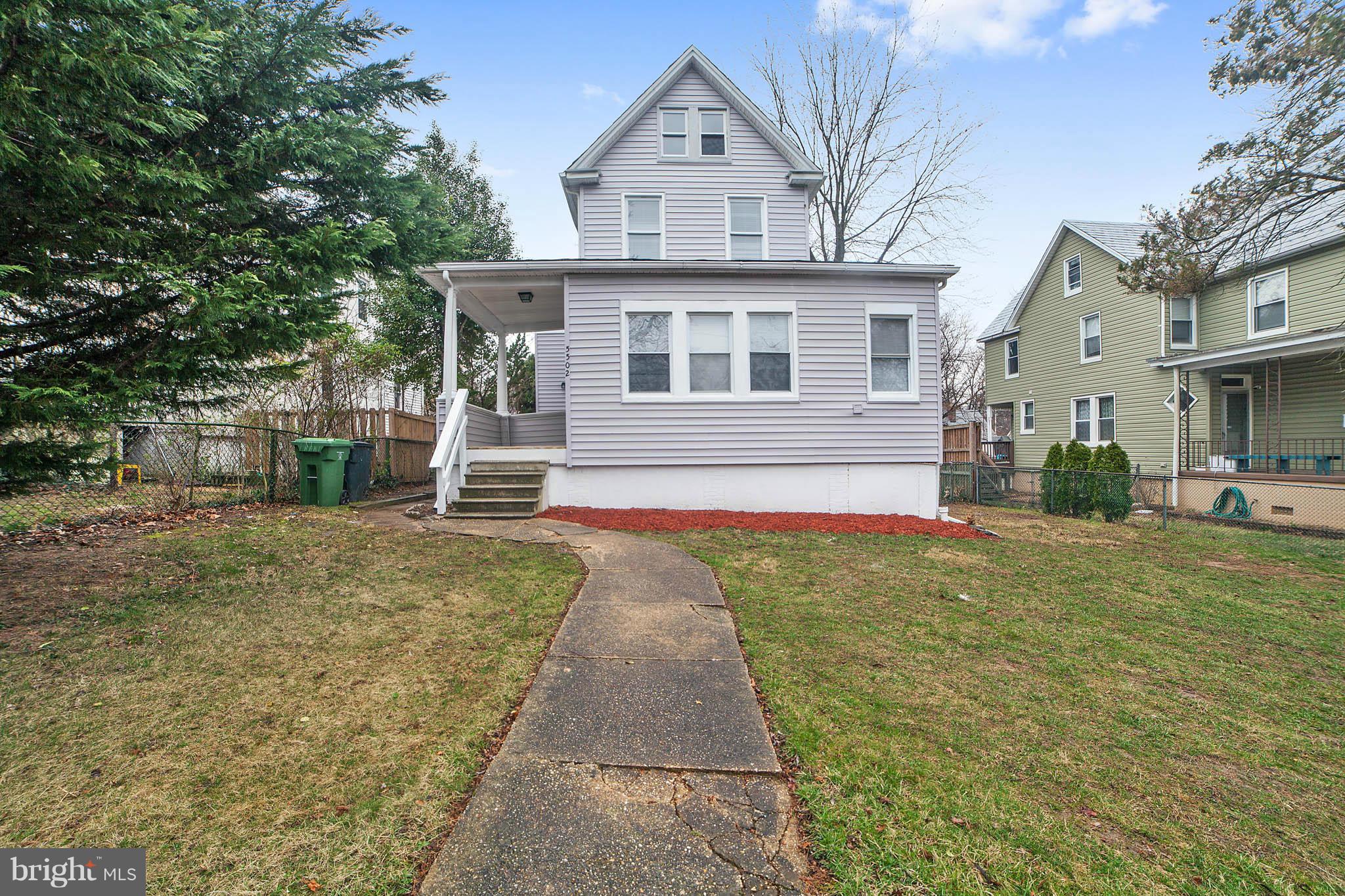5502 Tramore Road Baltimore, MD 21214 - Photo 2 of 30 a front view of a house with a yard