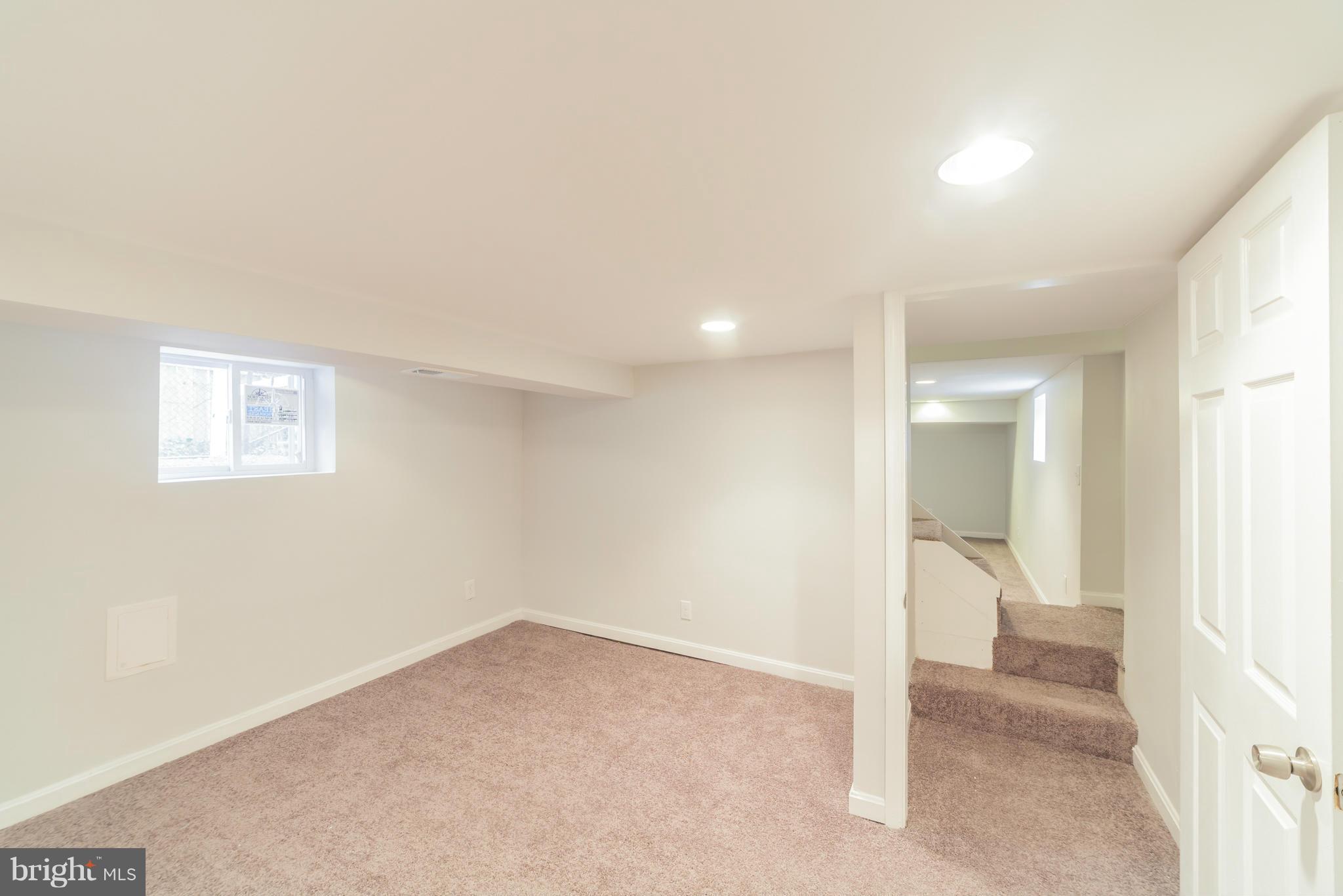 5502 Tramore Road Baltimore, MD 21214 - Photo 18 of 30 a view of an empty room and a window