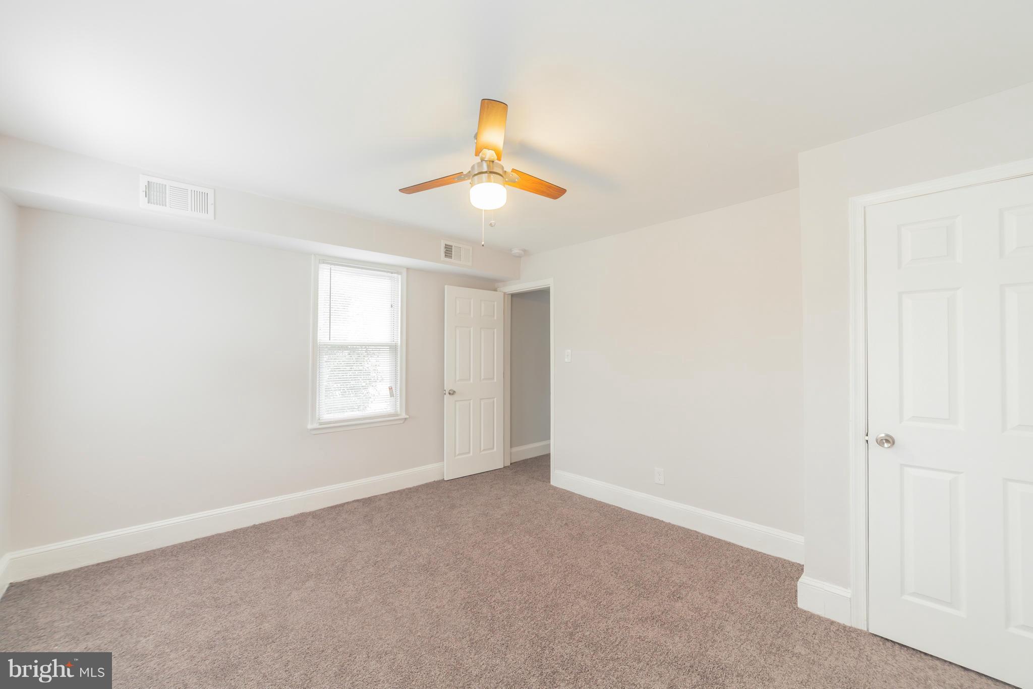 5502 Tramore Road Baltimore, MD 21214 - Photo 21 of 30 a view of an empty room with a window