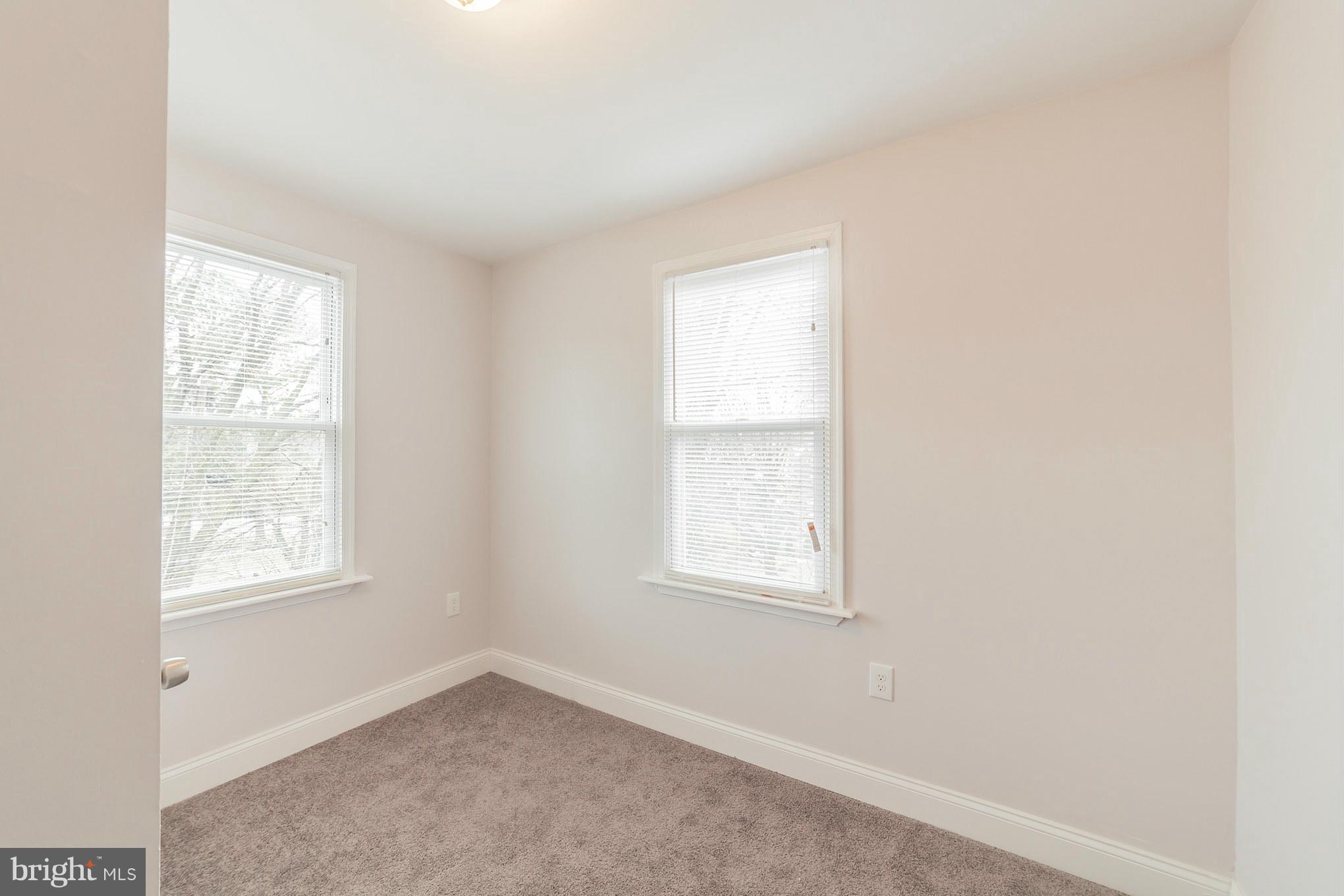 5502 Tramore Road Baltimore, MD 21214 - Photo 24 of 30 an empty room with windows