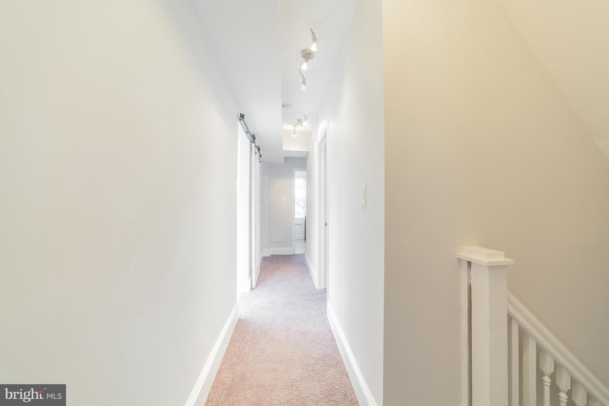 5502 Tramore Road Baltimore, MD 21214 - Photo 29 of 30 a view of a hallway with a white walls