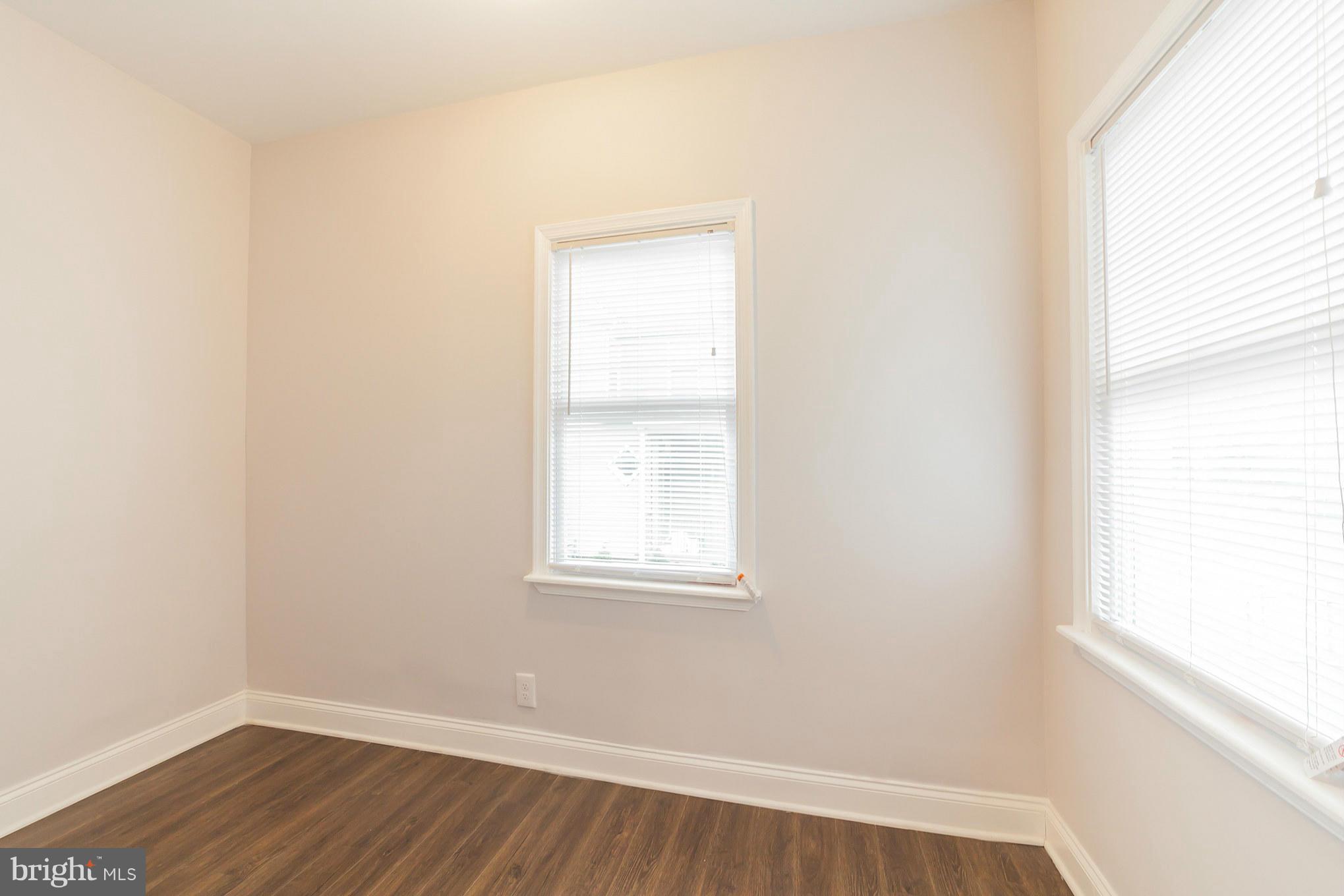 5502 Tramore Road Baltimore, MD 21214 - Photo 9 of 30 a view of a small space with wooden floor and a window