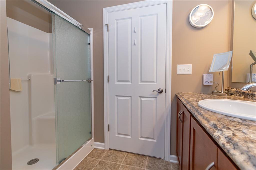 425 Chestnut Lane Apollo, PA 15613 - Photo 24 of 48 a bathroom with a granite countertop sink and a mirror