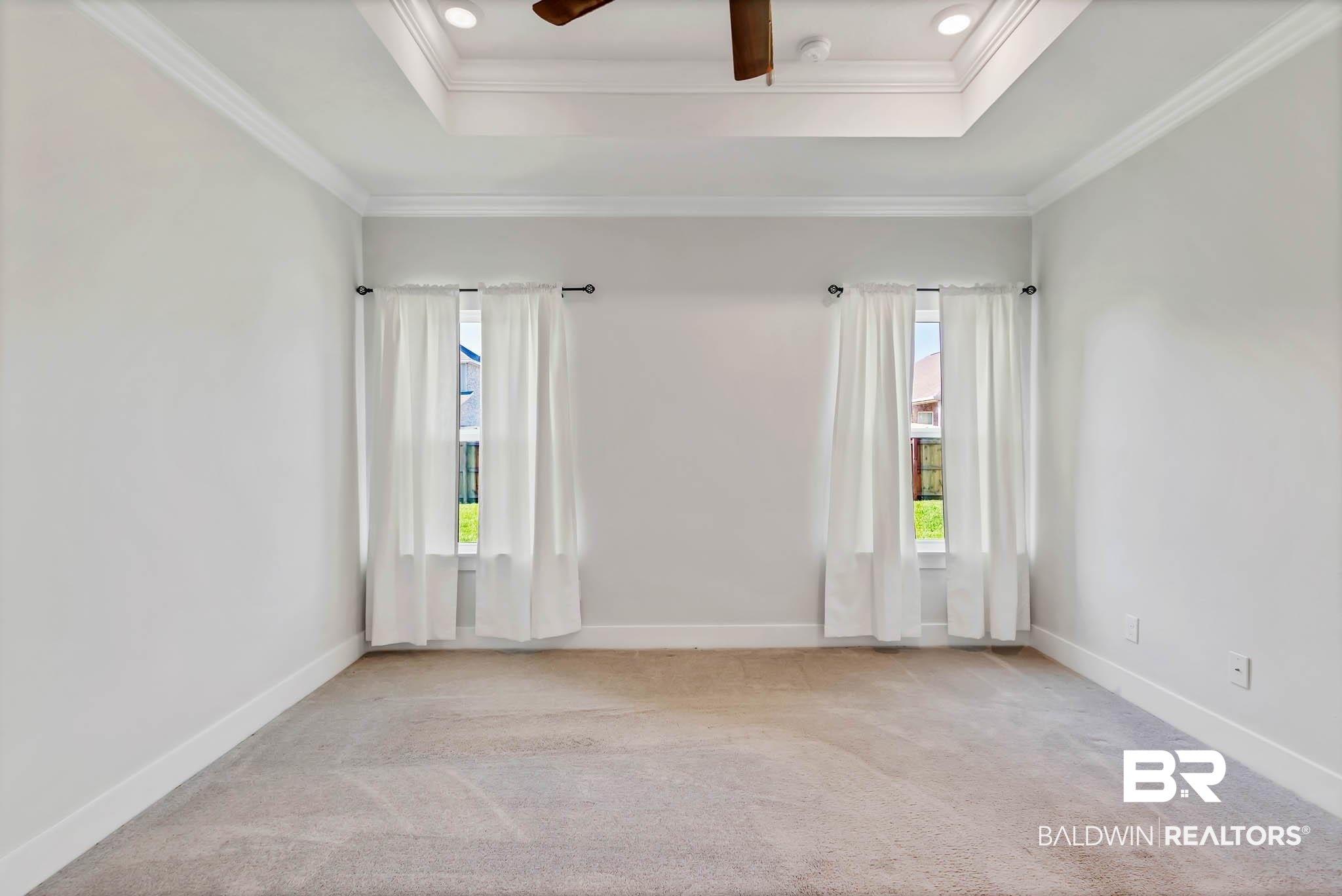 16461 Prado Loop Loxley, AL 36551 - Photo 42 of 78 Carpeted empty room featuring crown molding, a raised ceiling, ceiling fan, and recessed lighting