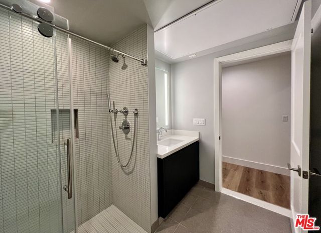 a view of wooden floor and a window in a room