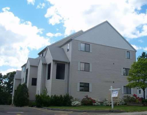 45 Stuart Avenue, Unit K Norwalk, CT 06850 - Photo 1 of 1 a view of a white house next to a yard