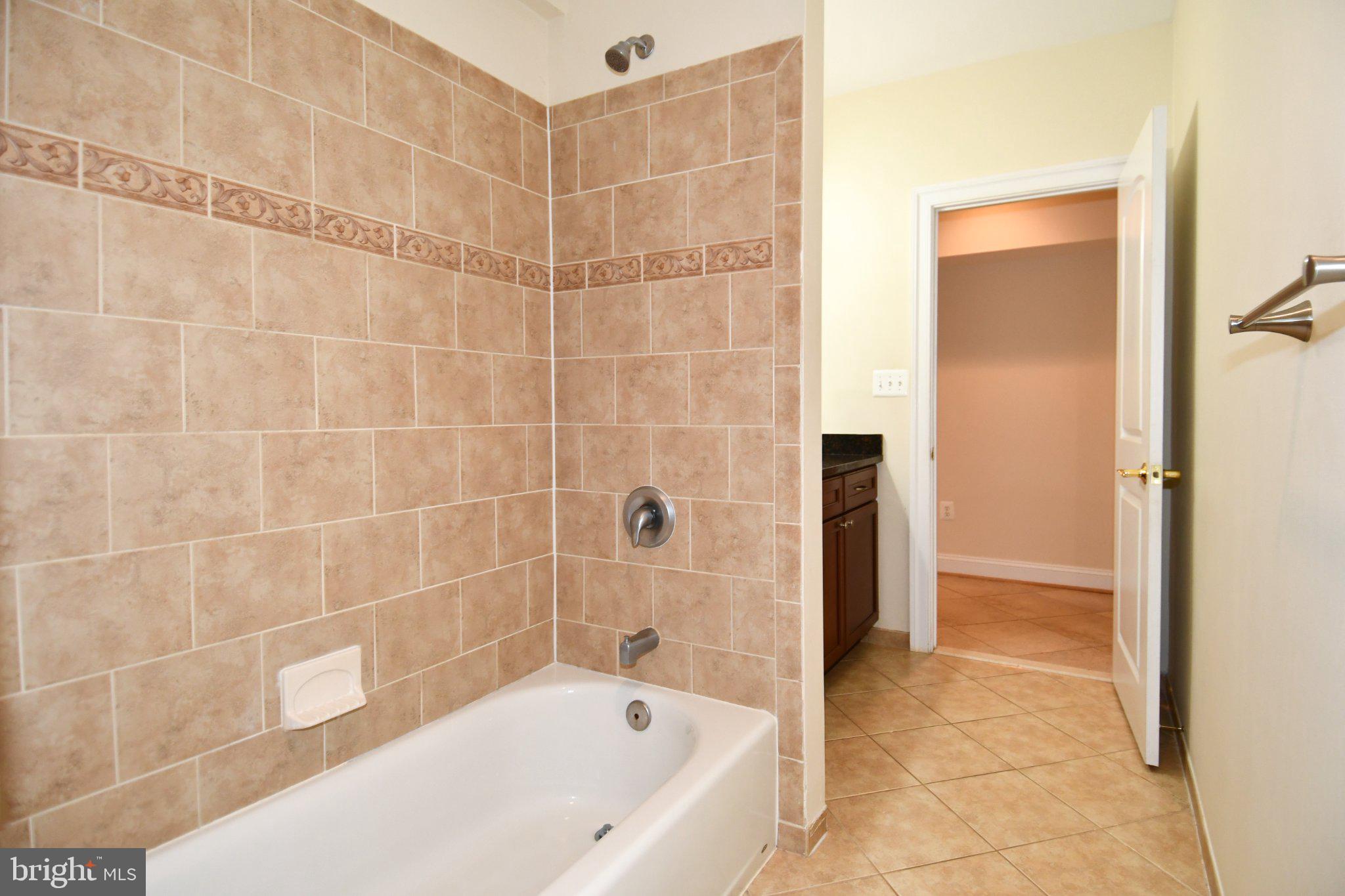 1924 Leonard Road Falls Church, VA 22043 - Photo 55 of 61 Elegant bathroom with tiled accents.
