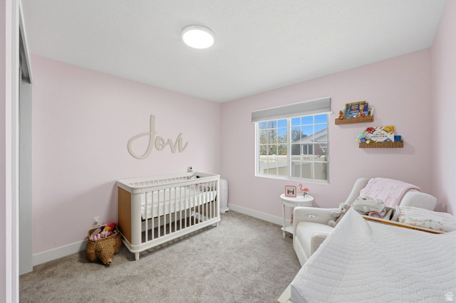 1795 South 200 West Bountiful, UT 84010 - Photo 15 of 37 Bedroom with a nursery area and light colored carpet