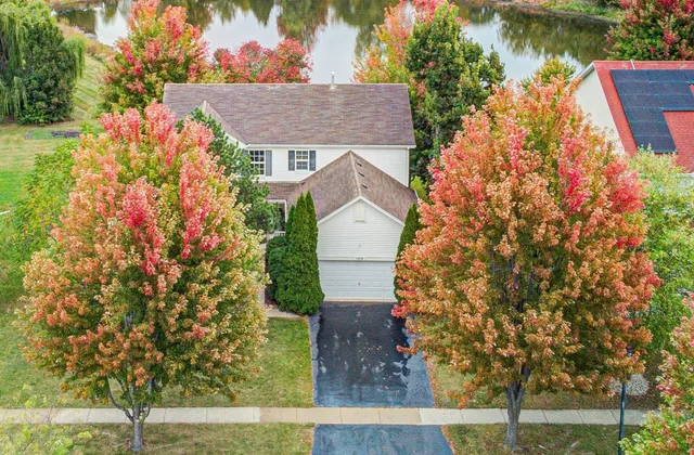 a aerial view of house with yard and seating area