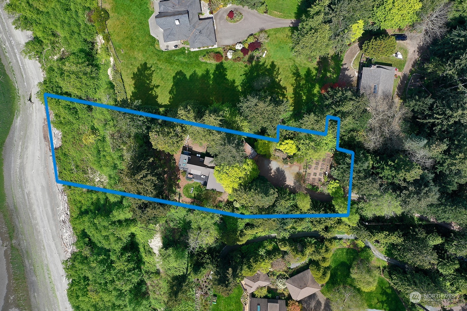 6828 Sills Road Clinton, WA 98236 - Photo 33 of 40 an aerial view of a house with a yard