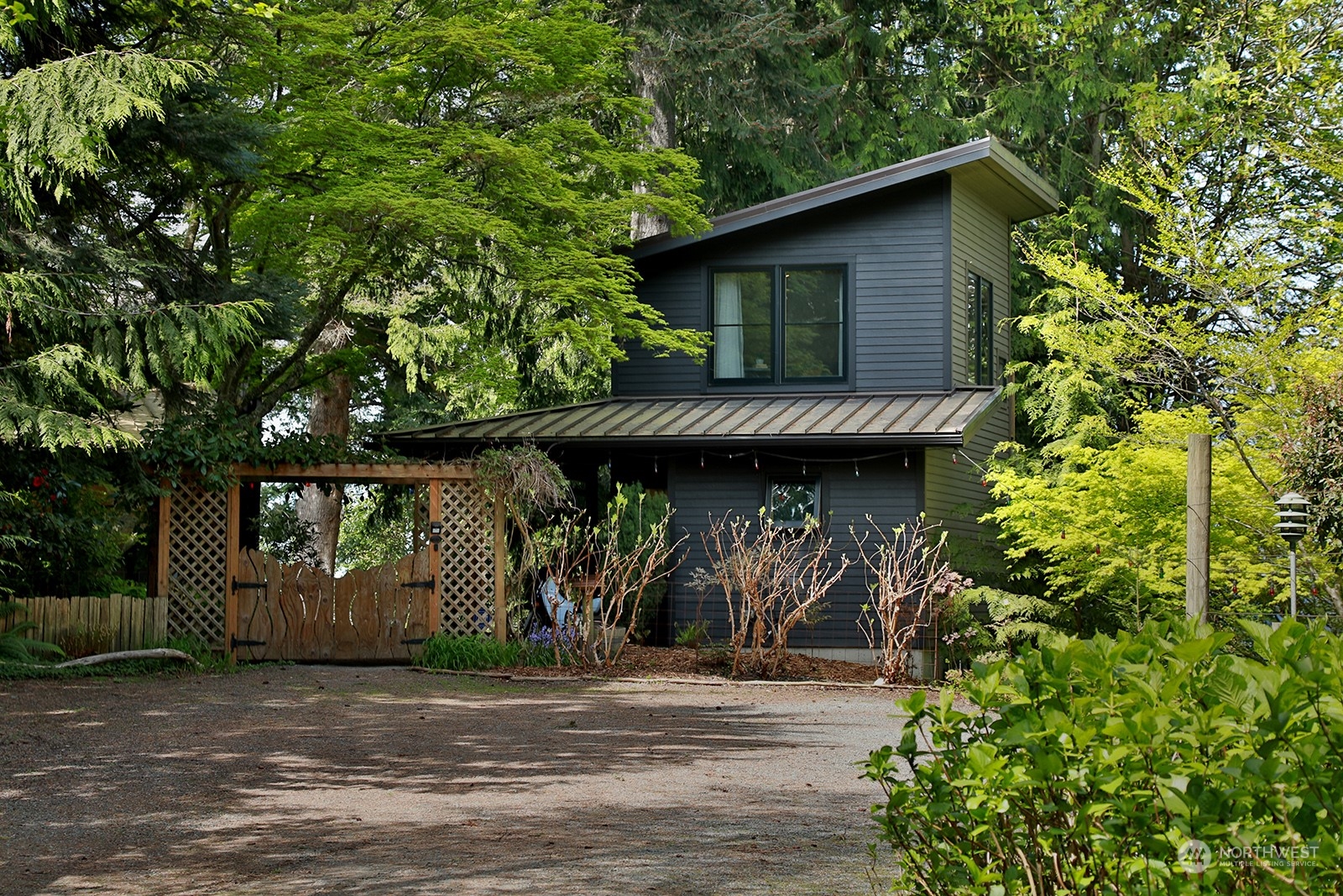 6828 Sills Road Clinton, WA 98236 - Photo 7 of 40 a front view of a house with garden