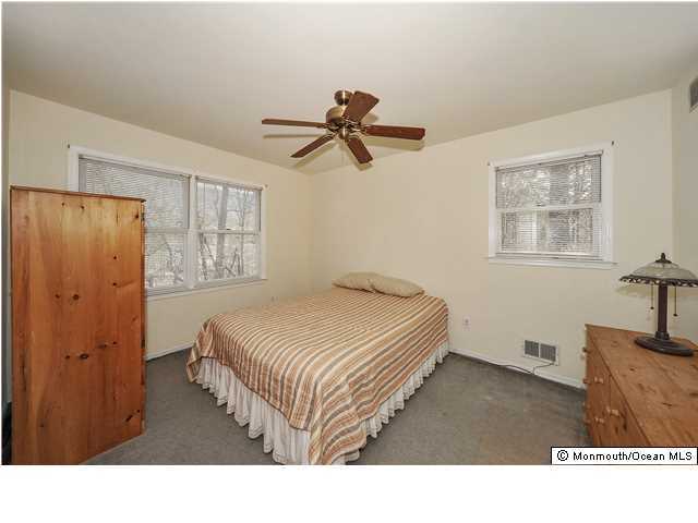 148 Sams Road Jackson, NJ 08527 - Photo 11 of 18 a living room with a bed furniture and a window