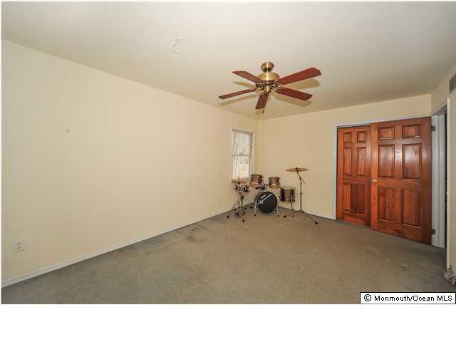148 Sams Road Jackson, NJ 08527 - Photo 13 of 18 a room with a ceiling fan