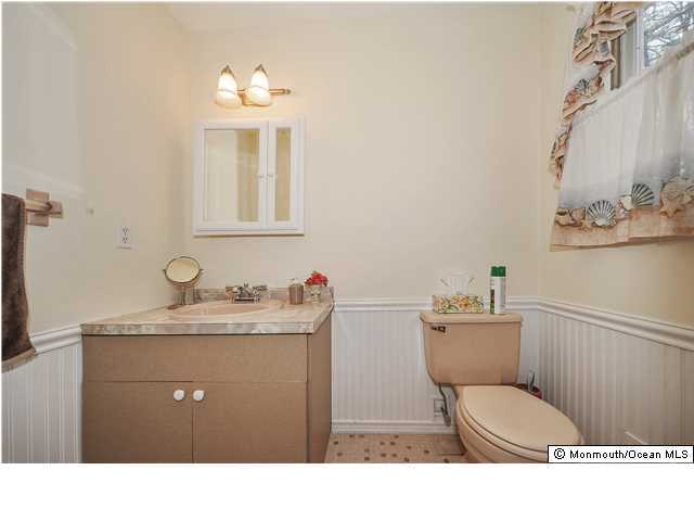148 Sams Road Jackson, NJ 08527 - Photo 15 of 18 a bathroom with a toilet a sink and mirror