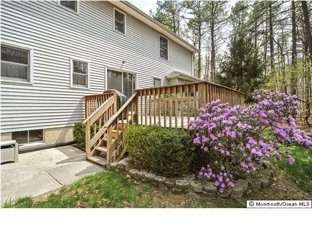 148 Sams Road Jackson, NJ 08527 - Photo 4 of 18 a view of a house with a yard and a garden