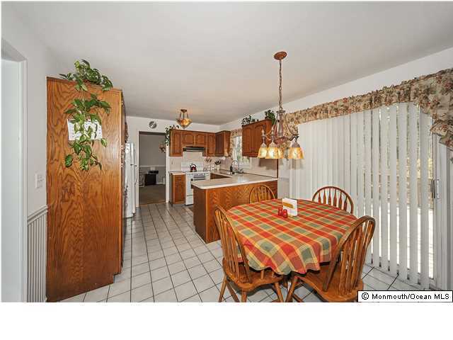 148 Sams Road Jackson, NJ 08527 - Photo 6 of 18 a bedroom with furniture and a chandelier