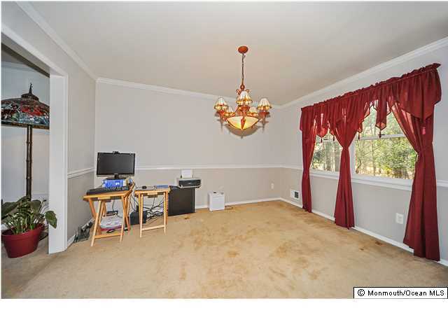 148 Sams Road Jackson, NJ 08527 - Photo 7 of 18 a living room with furniture and a flat screen tv