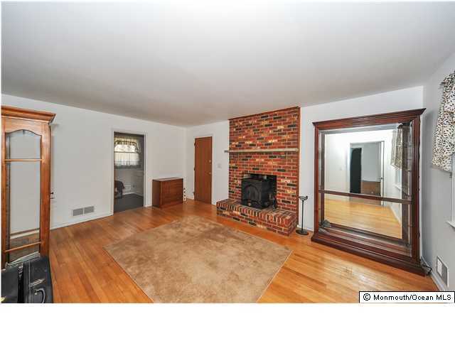 148 Sams Road Jackson, NJ 08527 - Photo 9 of 18 a room with a bed and a fireplace