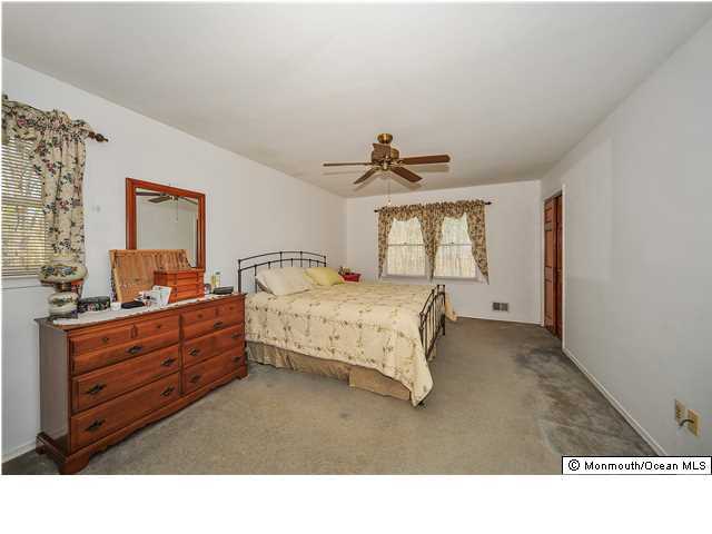 148 Sams Road Jackson, NJ 08527 - Photo 10 of 18 a living room with furniture and window
