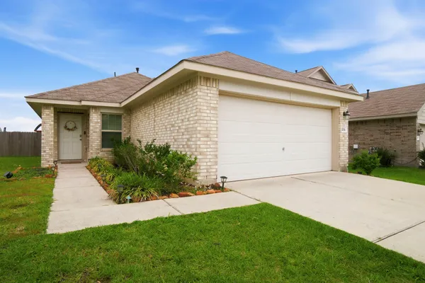 a view of an house with backyard space and garden