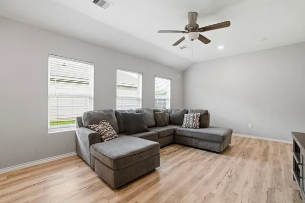 a living room with couches and a coffee table
