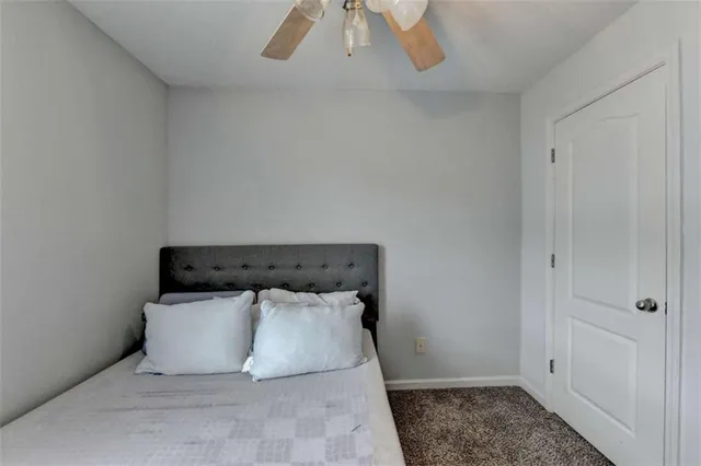 a bed and a night stand in a room