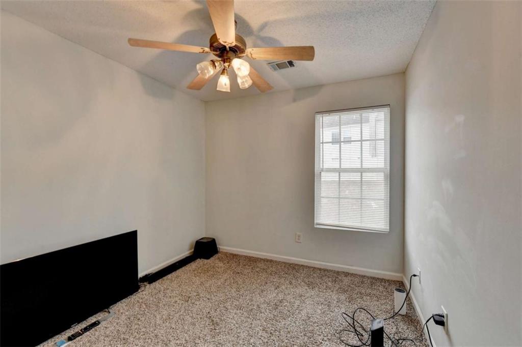 526 Terrapin Lane Winder, GA 30680 - Photo 29 of 40 an empty room with windows and fan