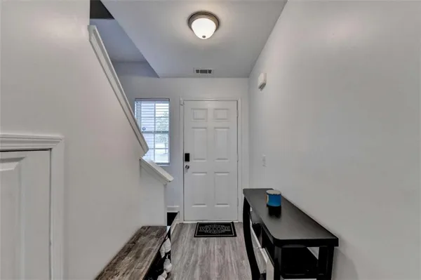 a view of entryway with wooden floor