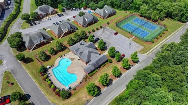 an aerial view of a house with outdoor space