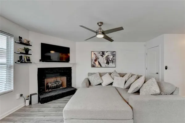 a bedroom with a bed and a fireplace