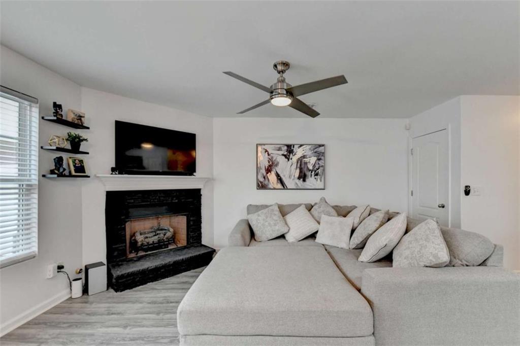 526 Terrapin Lane Winder, GA 30680 - Photo 7 of 40 a bedroom with a bed and a fireplace