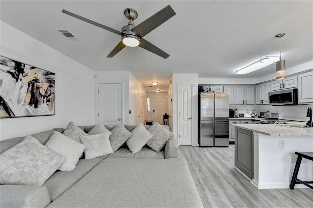 526 Terrapin Lane Winder, GA 30680 - Photo 9 of 40 a living room with furniture and kitchen view