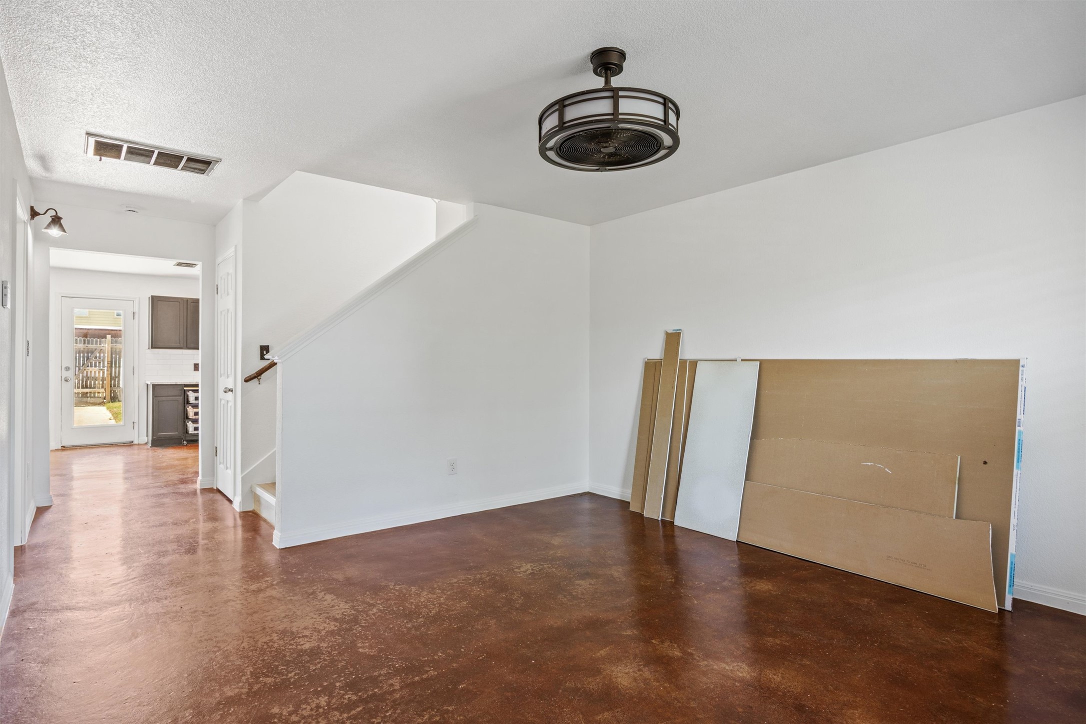 4516 Kind Way, Unit 253 Austin, TX 78725 - Photo 26 of 31 a view of empty room with wooden floor