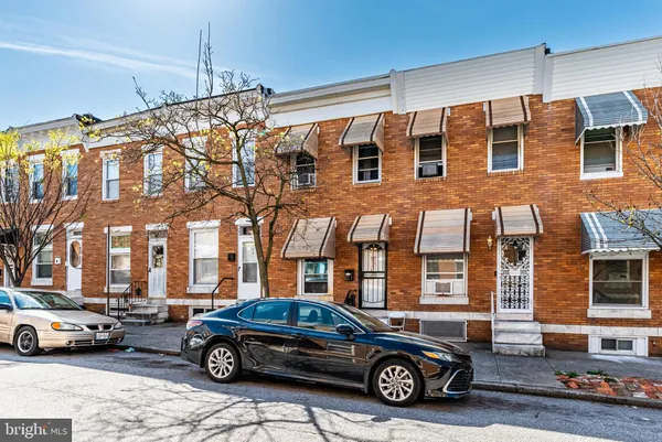 a car parked in front of a building