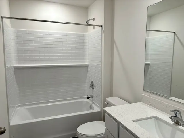 a bathroom with a sink and a shower