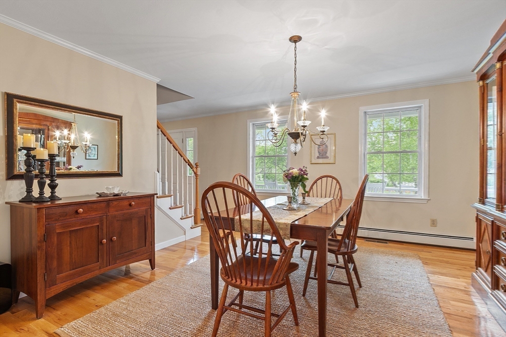86 South Cross Road Haverhill, MA 01835 - Photo 18 of 42 a view of a dining room with furniture a chandelier and wooden floor