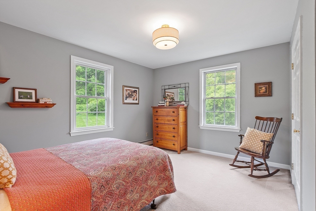 86 South Cross Road Haverhill, MA 01835 - Photo 26 of 42 a bedroom with a bed a chair and a window