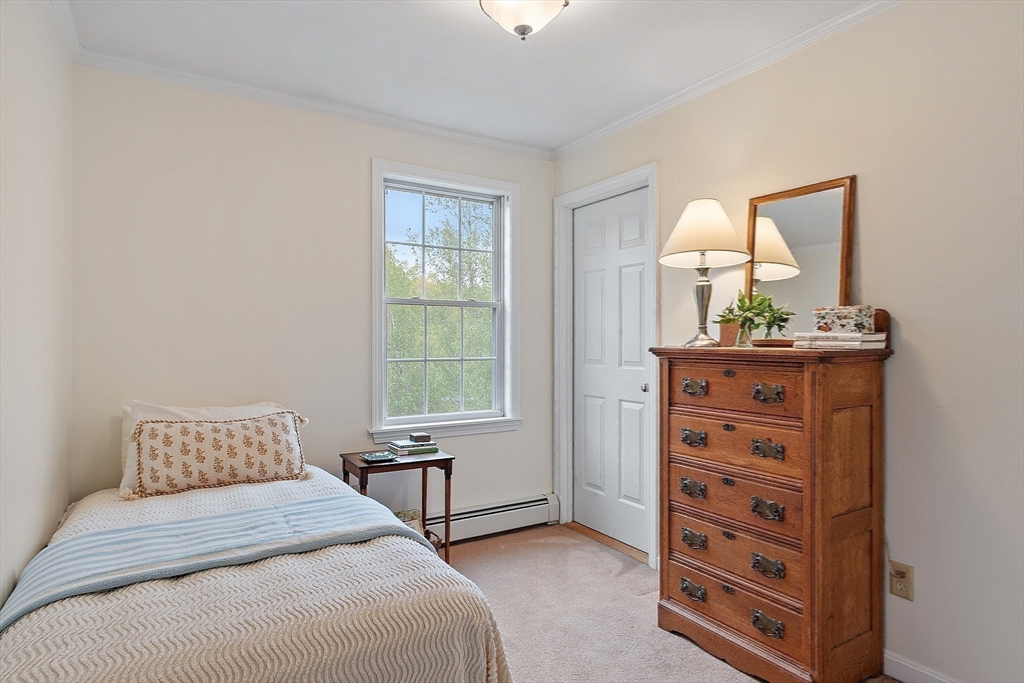 86 South Cross Road Haverhill, MA 01835 - Photo 28 of 42 a bedroom with a bed a dresser and next to a window