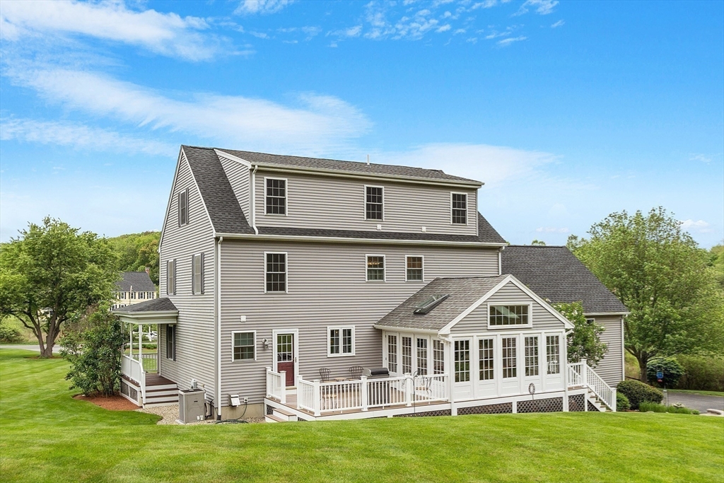 86 South Cross Road Haverhill, MA 01835 - Photo 3 of 42 a front view of a house with a garden