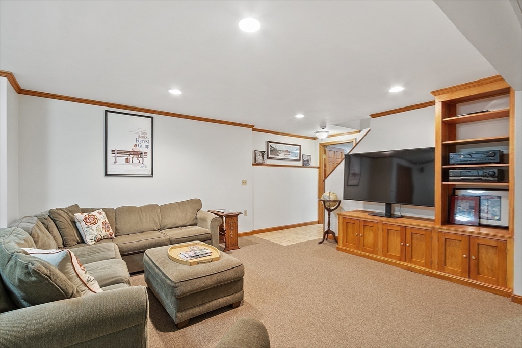 86 South Cross Road Haverhill, MA 01835 - Photo 31 of 42 a living room with furniture and a flat screen tv