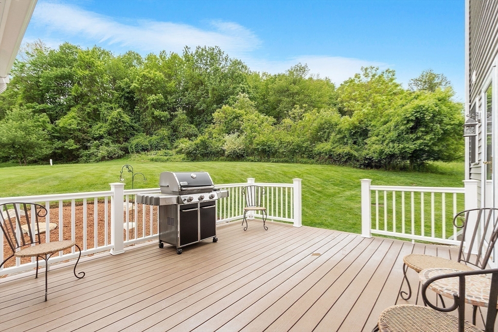 86 South Cross Road Haverhill, MA 01835 - Photo 35 of 42 a view of a deck with wooden floor and fence with a large garden