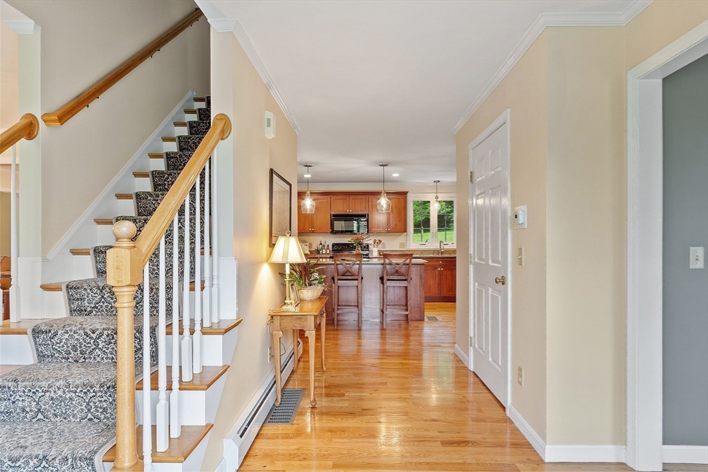 86 South Cross Road Haverhill, MA 01835 - Photo 9 of 42 a hallway with dining table and chairs