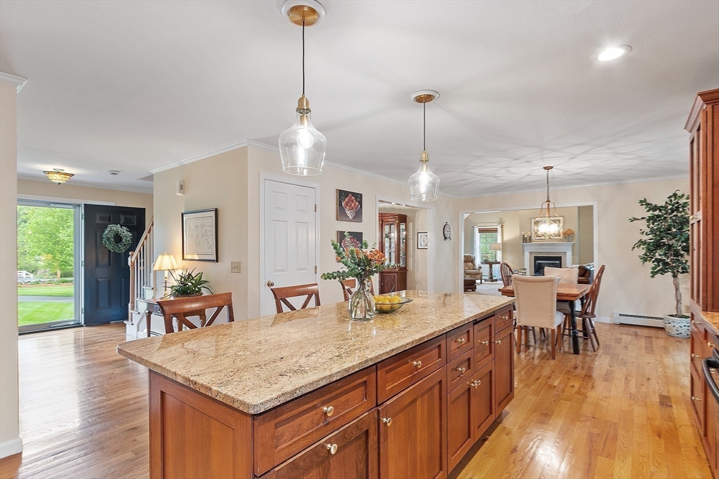 86 South Cross Road Haverhill, MA 01835 - Photo 10 of 42 a view of a kitchen counter top space with furniture wooden floor and windows