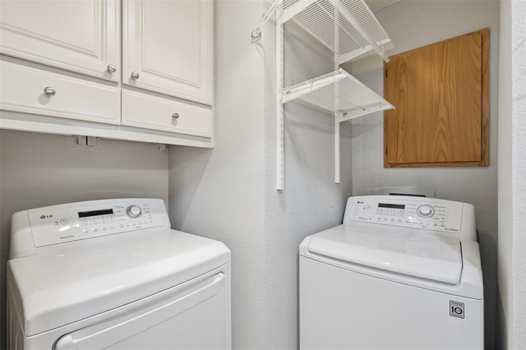 14584 Blueberry Court Addison, TX 75001 - Photo 18 of 40 a utility room with dryer and washer